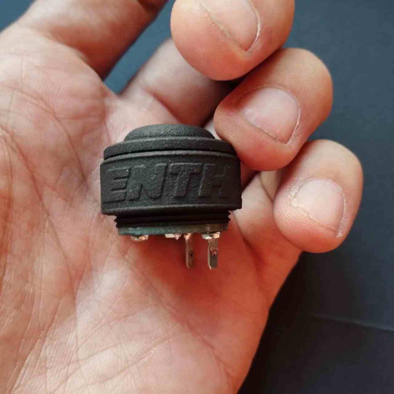 a person holding a cell phone in their hand 