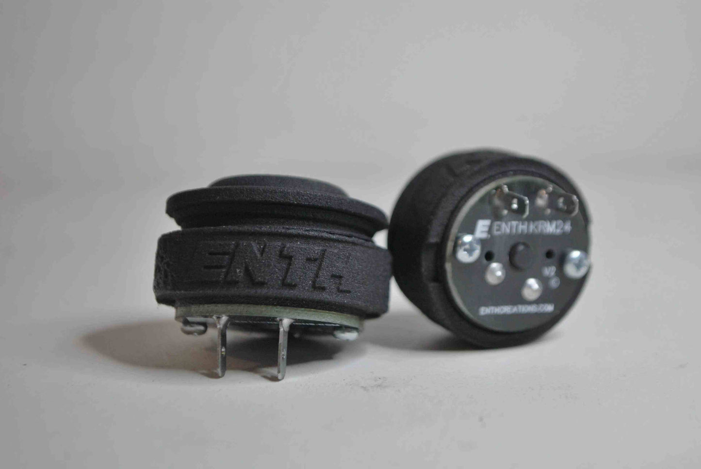 a black and white photo of a car and a clock 
